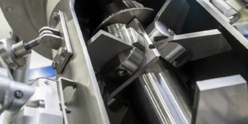 Mélangeur continu vertical pour poudres sèches repensé